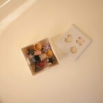 Mushie formų rūšiavimo kubas – lavinamasis žaislas